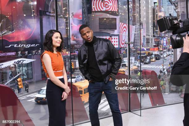 Actress Miranda Cosgrove visits "Extra" with A.J. Calloway at H&M Times Square on December 6, 2017 in New York City.