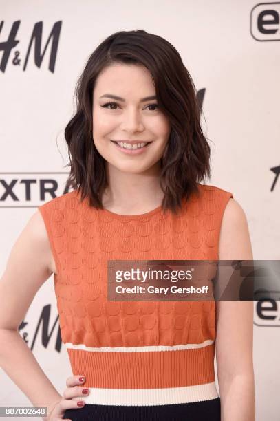 Actress Miranda Cosgrove visits "Extra" at H&M Times Square on December 6, 2017 in New York City.