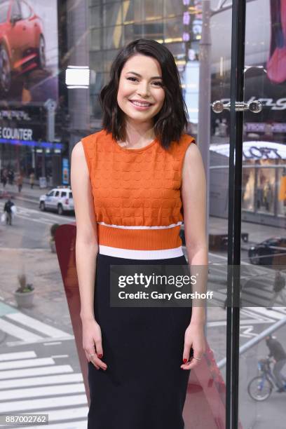 Actress Miranda Cosgrove visits "Extra" at H&M Times Square on December 6, 2017 in New York City.