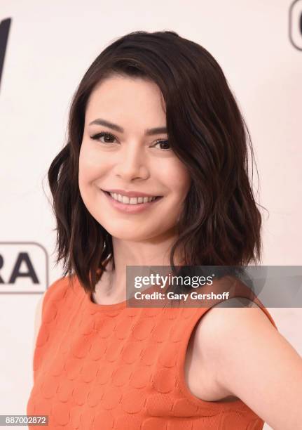 Actress Miranda Cosgrove visits "Extra" at H&M Times Square on December 6, 2017 in New York City.