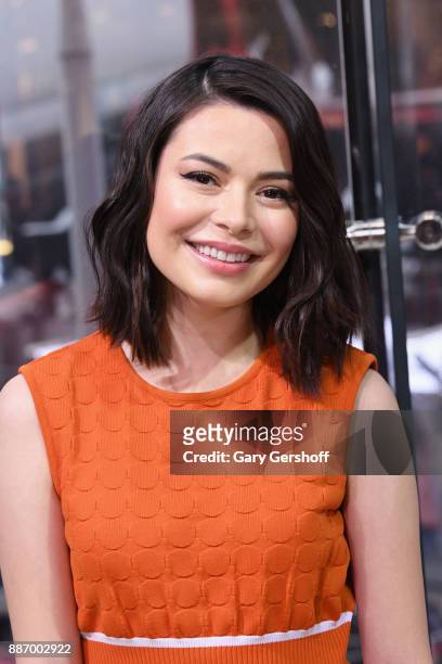 Actress Miranda Cosgrove visits "Extra" at H&M Times Square on December 6, 2017 in New York City.