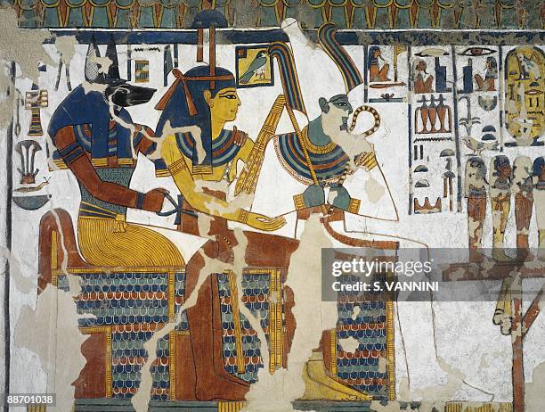Egypt, Thebes - Luxor - Valley of the Queens. Tomb of Nefertari. Burial chamber. Mural paintings. Anubis, Isis and Osiris
