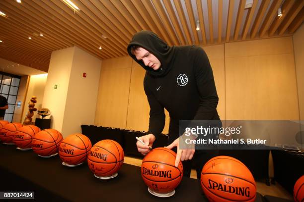 Timofey Mozgov of the Brooklyn Nets does ball signings as part of the NBA Mexico Games 2017 on December 6, 2017 at the Hyatt Regency Hotel in Mexico...
