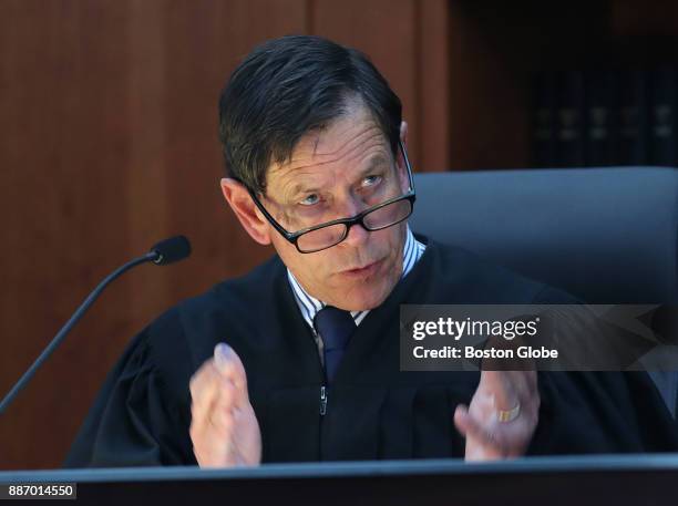 Judge Jeffrey Locke asks a question of a witness during the trial of three prison guards facing manslaughter charges in the 2009 death of a...