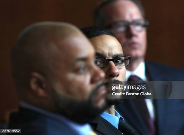 From left, defendants Derek Howard,John Raposo, and George Billadeau watch a video of themselves on a screen in the courtroom during their trial,...