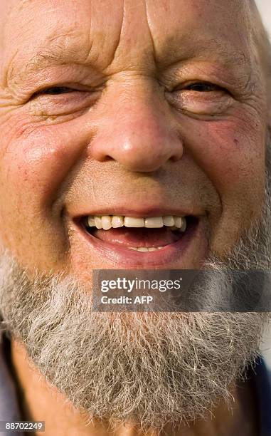 Festival founder Michael Eavis poses for photographers in the backstage area behind the Pyramid stage on the first "official" day of the annual...