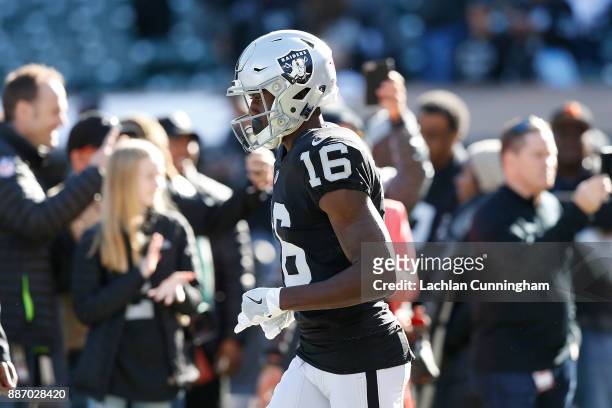 Johnny Holton of the Oakland Raiders runs out for the warm up before their game against the New York Giants at Oakland-Alameda County Coliseum on...
