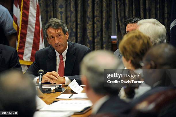 South Carolina Gov. Mark Sanford speak to his Cabinet during a special meeting in the Governor's Conference Room in the Wade Hampton Building at the...