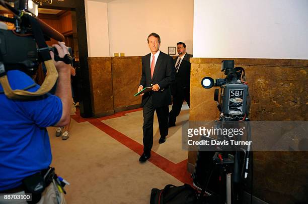 South Carolina Gov. Mark Sanford arrive for a special meeting with his Cabinet in the Wade Hampton Building at the Statehouse complex on June 2009....