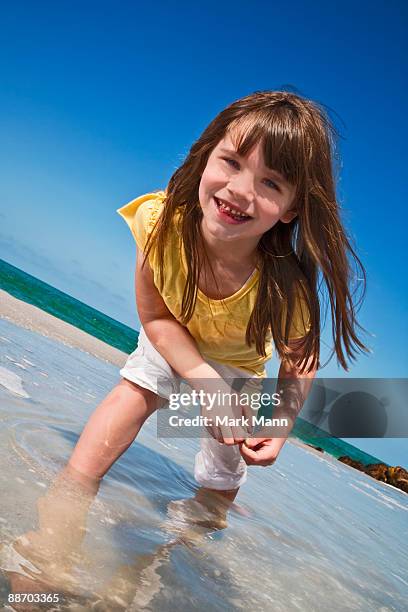 young girl in a tide pool at the beach. - captiva island stock-fotos und bilder