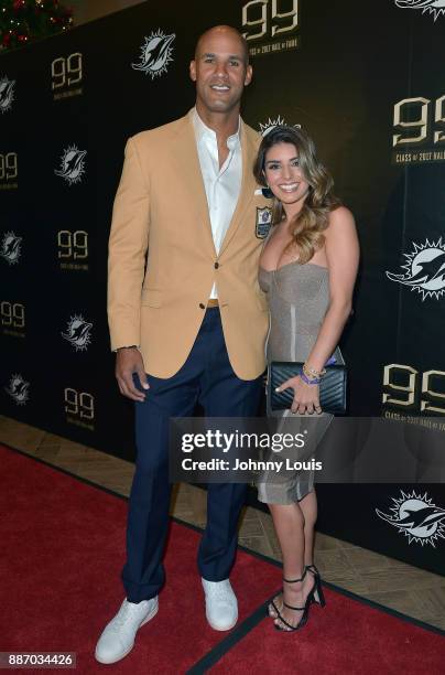 Jason Taylor and Monica Velasco attend The Miami Dolphins 'Hall of Fame Celebration' hosting Jason Taylor at Hard Rock Stadium on December 02, 2017...