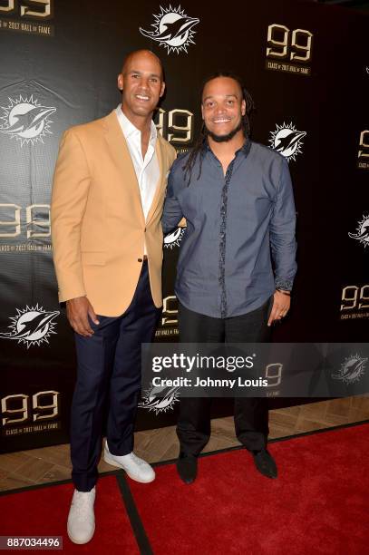 Jason Taylor and Channing Crowder attend The Miami Dolphins 'Hall of Fame Celebration' hosting Jason Taylor at Hard Rock Stadium on December 02, 2017...