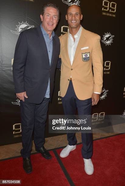 Dan Marino and Jason Taylor attends The Miami Dolphins 'Hall of Fame Celebration' hosting Jason Taylor at Hard Rock Stadium on December 02, 2017 in...