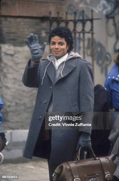 Popular American musician Michael Jackson waves during the filming of the long-form music video for his song 'Bad,' directed by Martin Scorsese, New...