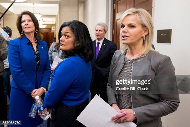 From left, Rep. Cheri Bustos, D-Ill., Rep. Pramila Jayapal, D-Wash., Rep. Walter Jones, R-N.C., and Gretchen Carlson huddle before their press...