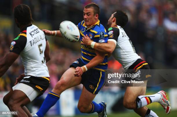 Lee Smith of Leeds Rhinos is tackled during the Engage Super League match between Leeds Rhinos and Bradford Bulls at Headingley Stadium on June 26,...