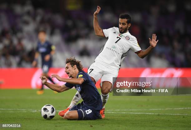 Albert Riera of Auckland City FC is fouled by Ali Mabkhout of Al-Jazira during the FIFA Club World Cup UAE 2017 play off match between Al Jazira and...