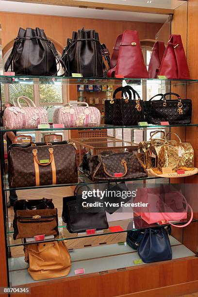 Genuine and counterfeit bags are displayed at the Counterfeit Museum on June 25, 2009 in Paris, France. The museum serves to highlight the impact...