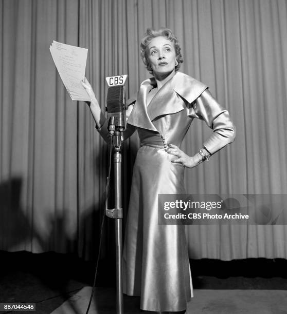 Marlene Dietrich while recording. She portrays Dianne La Volte on the CBS Radio adventure drama program A Time For Love. October 16, 1953. New York,...