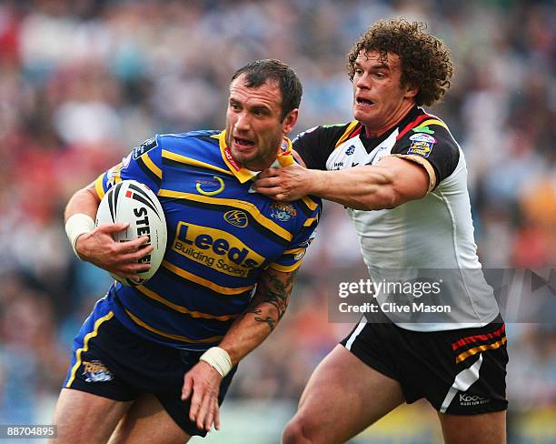 Jamie Peacock of Leeds Rhinos is tackled by Jamie Langley of Bradford Bulls during the Engage Super League match between Leeds Rhinos and Bradford...