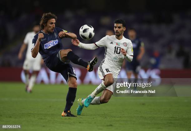 Albert Riera of Auckland City FC is challenged by Mbark Boussoufa of Al-Jazira during the FIFA Club World Cup UAE 2017 play off match between Al...