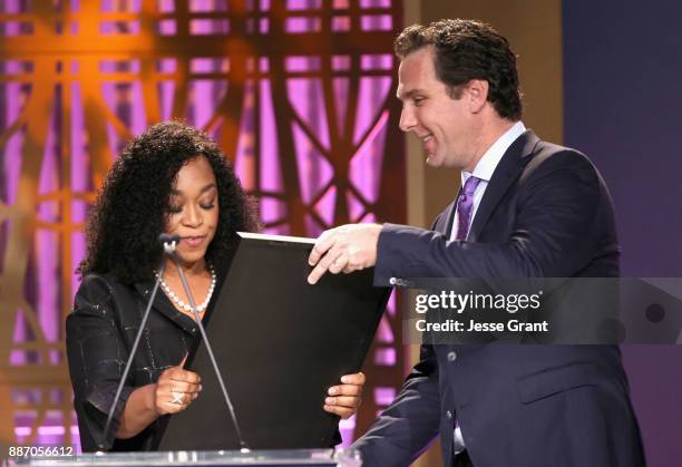 Shonda Rhimes accepts award from THR Editorial Director Matthew Belloni onstage at The Hollywood Reporter's 2017 Women In Entertainment Breakfast at...