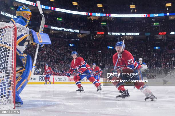 Montreal Canadiens left wing Nicolas Deslauriers and Montreal Canadiens left wing Daniel Carr forecheck during the first period of the NHL game...