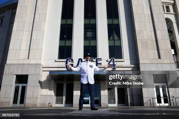 Aaron Boone poses for a photo after being introduced as manager of the New York Yankees at Yankee Stadium on December 6, 2017 in the Bronx borough of...