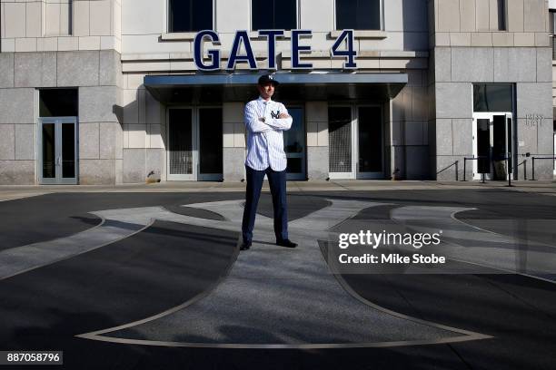 Aaron Boone poses for a photo after being introduced as manager of the New York Yankees at Yankee Stadium on December 6, 2017 in the Bronx borough of...