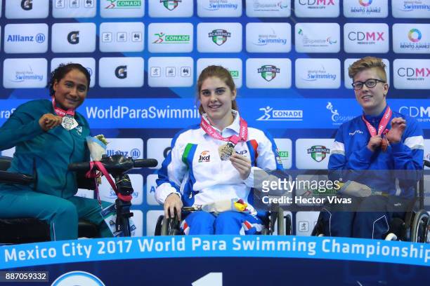 Patricia Pereira of Brazil silver medal, Monica Boggioni of Italy gold medal and Sonja Sigurdardottir bronze medal in Women's 100 m Freestyle S4 pose...