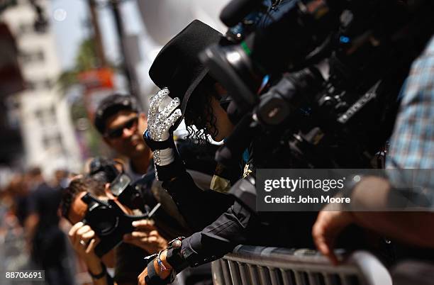 Michael Jackson impersonator Hector Rojas from Mexico City pays his respects at Jackson's star on the Walk of Fame on June 26 a day after his death...