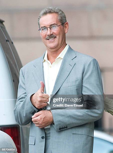 Stanford Financial chairman and CEO Sir Robert Allen Stanford gestures as he leaves the Bob Casey Federal Courthouse after a bond hearing June 26,...