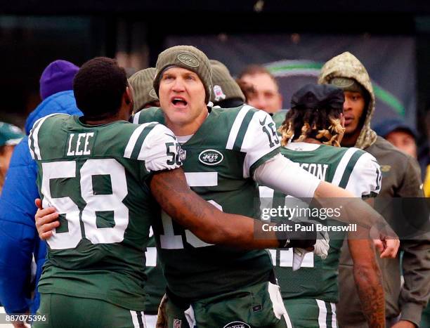 Quarterback Josh McCown of the New York Jets celebrates a touchdown with teammate Darron Lee in an NFL football game against the Carolina Panthers on...