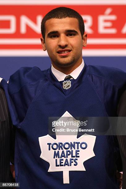 Nazem Kadri of the Toronto Maple Leafs looks on as he stands on stage after he was selected overall by the Leafs during the first round of the 2009...