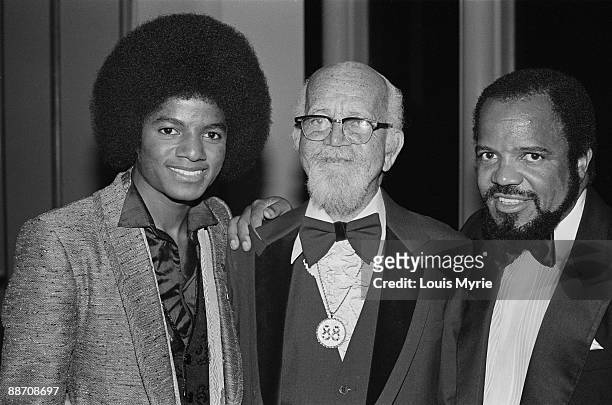 Michael Jackson with Berry Gordy Jr and Berry Gordy Sr on his 88th birthday at Windows on the World party, following the NYC premiere of The Wiz.