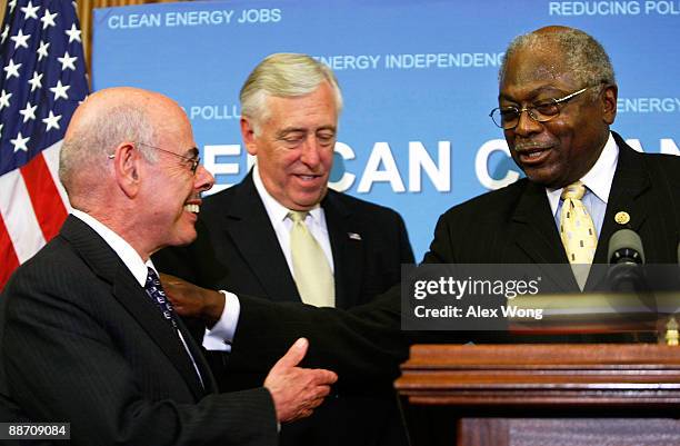 Rep. Henry Waxman and House Democratic Whip Rep. James Clyburn share a moment as House Democratic Leader Rep. Steny Hoyer looks on during a news...