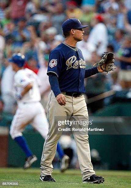 Pitcher Walter Silva of the San Diego Padres walks off the mound after giving up a three run homerun against David Murphy of the Texas Rangers in the...