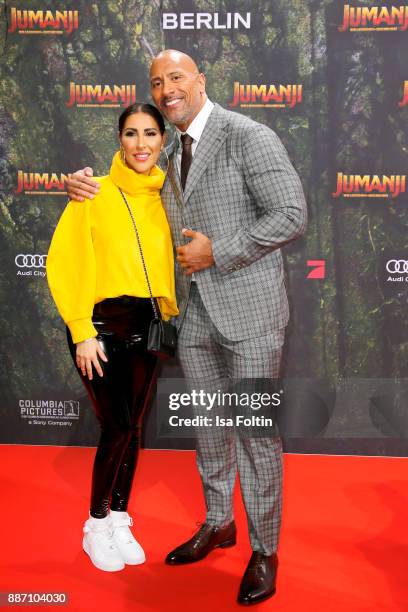 Senna Gammour and US actor Dwayne Johnson attend the German premiere of 'Jumanji: Willkommen im Dschungel' at Sony Centre on December 6, 2017 in...