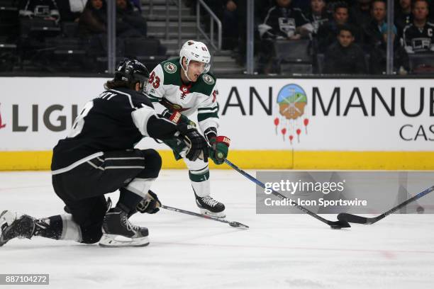 Minnesota Wild left wing Tyler Ennis attempts a shot on goal past Los Angeles Kings defenceman Drew Doughty during the game on December 05 at the...