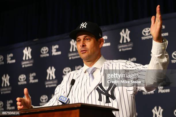 Aaron Boone speaks to the media after being introduced as manager of the New York Yankees at Yankee Stadium on December 6, 2017 in the Bronx borough...