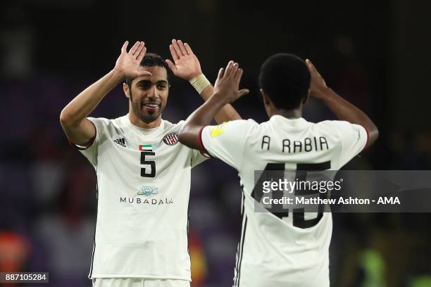 Musallem Fayez and Ahmed Rabia of Al Jazira celebrate at the end of the FIFA Club World Cup UAE 2017 play off match between Al Jazira and Auckland...