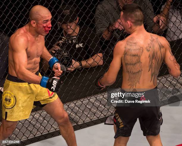 Jose Aldo fights Max Holloway during a UFC bout at Little Caesars Arena on December 2, 2017 in Detroit, Michigan. Holloway defeated Aldo with a TKO...