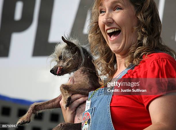 Dawn Goehring of Gatlinburg, Tennesse, holds her dog Miss Ellie, a Chinese Crested, during the 21st Annual World's Ugliest Dog Contest at the...