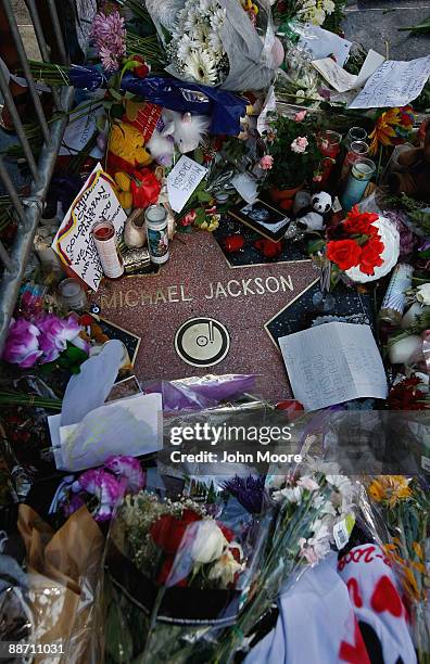 Flowers and tributes adorn Michael Jackson's star on the Walk of Fame on June 26 a day after his death in Los Angeles, California. Jackson the iconic...