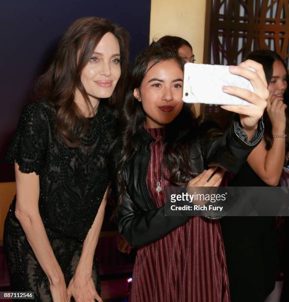 Angelina Jolie poses with mentee during The Hollywood Reporter's 2017 Women In Entertainment Breakfast at Milk Studios on December 6, 2017 in Los...