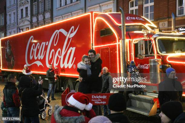 Hundreds of people gather to see the Christmas Coca Cola truck in Gdansk, Poland on 6 December 2017 Freightliner FLD Conventional truck is 16.5 m...