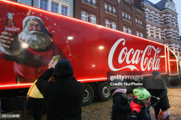 Hundreds of people gather to see the Christmas Coca Cola truck in Gdansk, Poland on 6 December 2017 Freightliner FLD Conventional truck is 16.5 m...