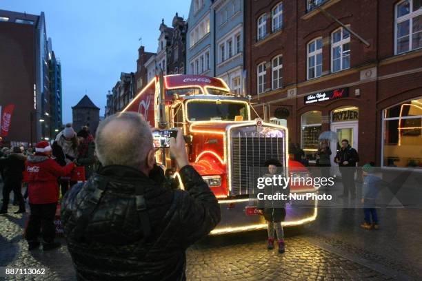 Hundreds of people gather to see the Christmas Coca Cola truck in Gdansk, Poland on 6 December 2017 Freightliner FLD Conventional truck is 16.5 m...