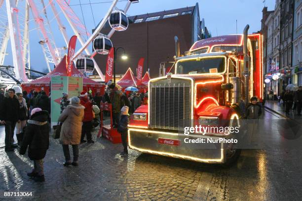 Hundreds of people gather to see the Christmas Coca Cola truck in Gdansk, Poland on 6 December 2017 Freightliner FLD Conventional truck is 16.5 m...