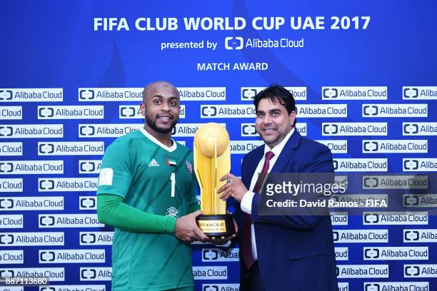 Ali Khaseif of Al-Jazira and Said Abu Sayeed Saleem, Ceo of Yvolv pose with the Man of the Match trophy after winning the FIFA Club World Cup UAE...